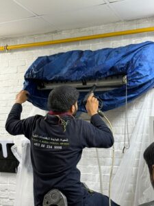 AC technician servicing split AC