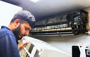 AC technician fixing AC